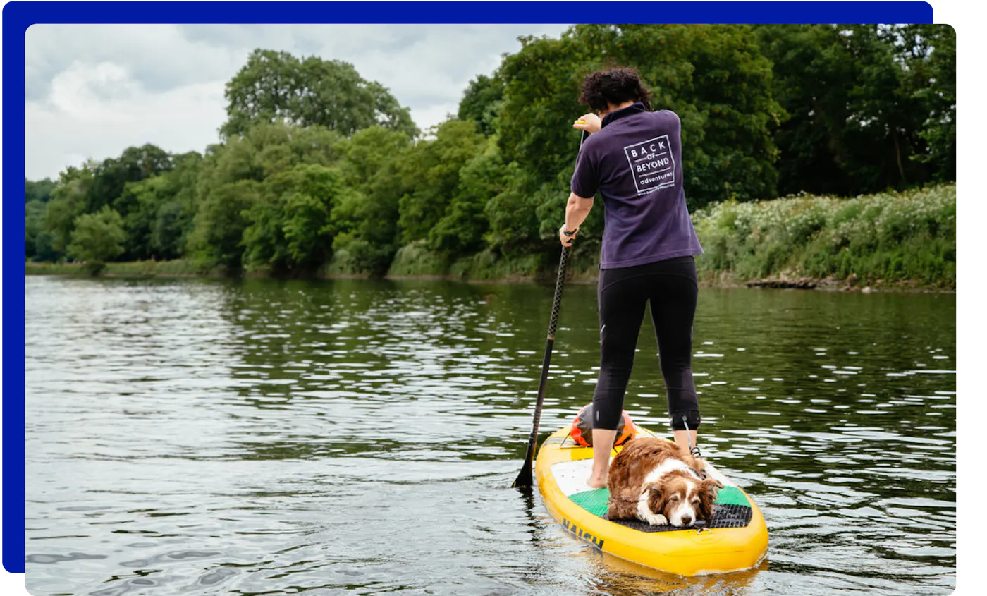 Paddleboarding in the River Thames with a dog
