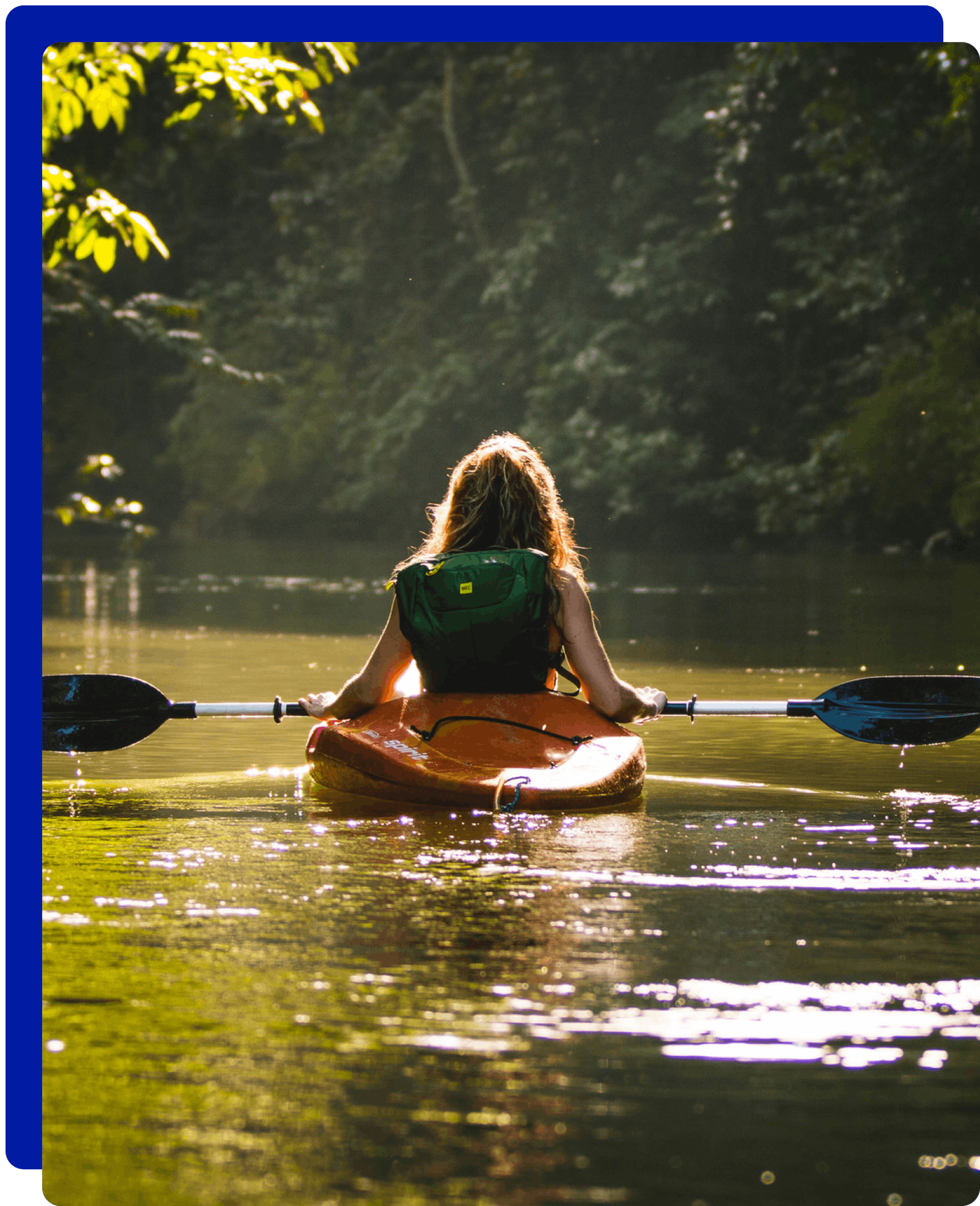 Woman paddling in River Thames