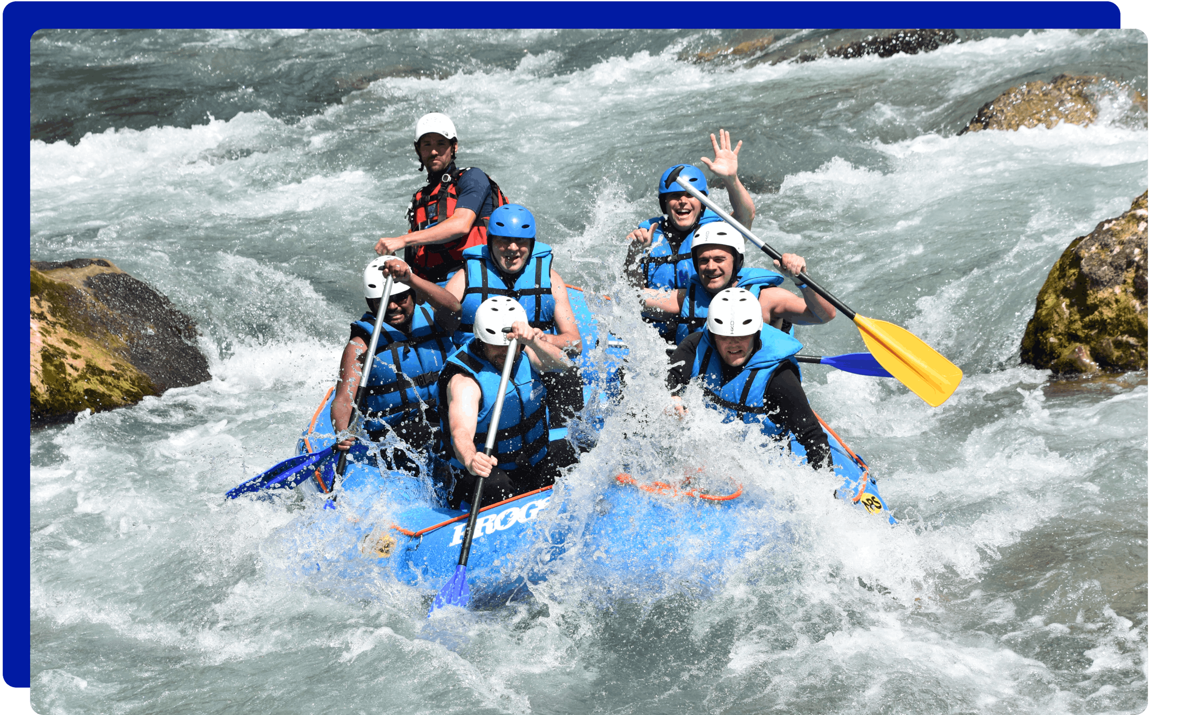 Group of people white water rafting with Frogs Rafting