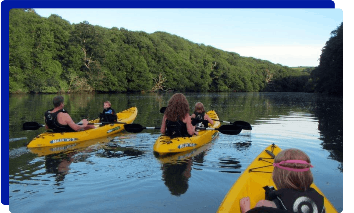 Group kayaking in Helford River Cornwall