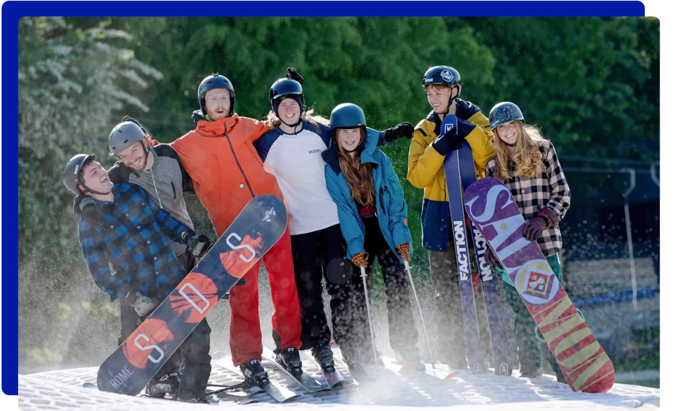 Group skiing and snowboarding at Norfolk Snowsports Club in Norwich