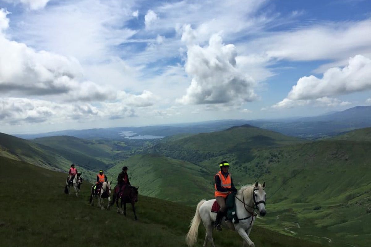 people riding on hills