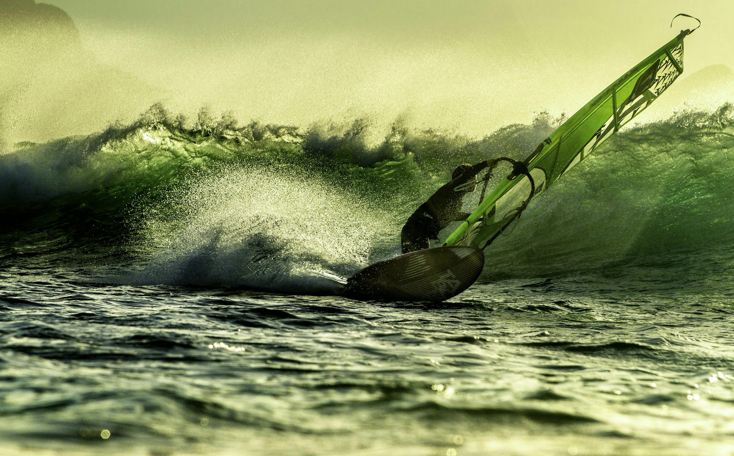 a person surfing on the waves