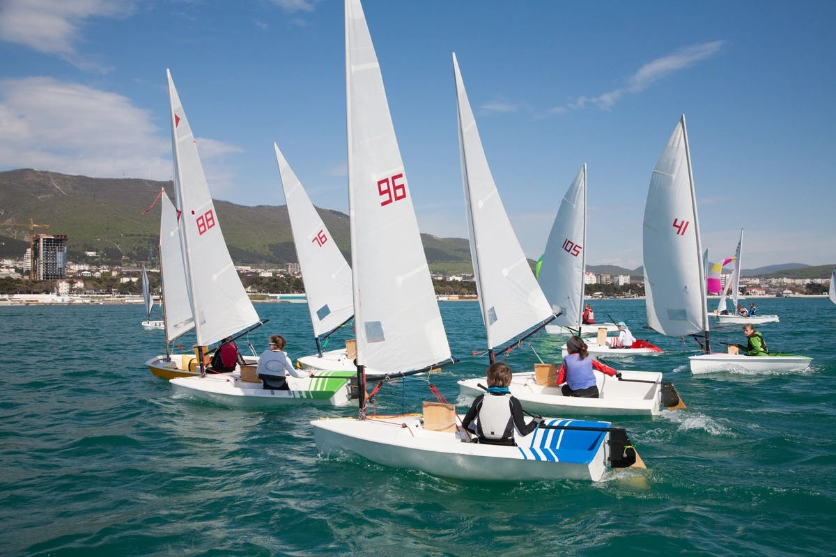 Several boats sailing on the ocean