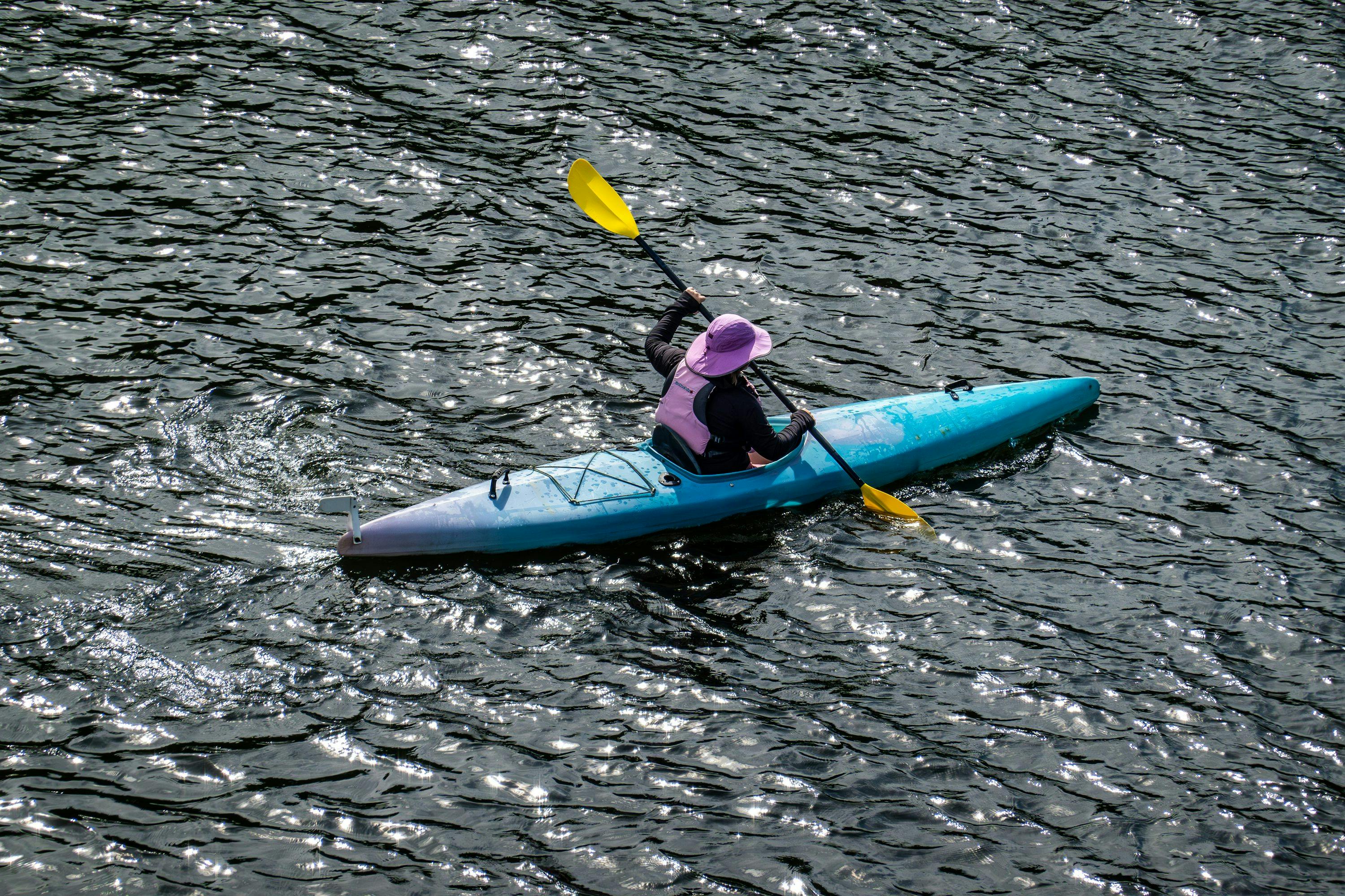 A person in a kayak on a body of water