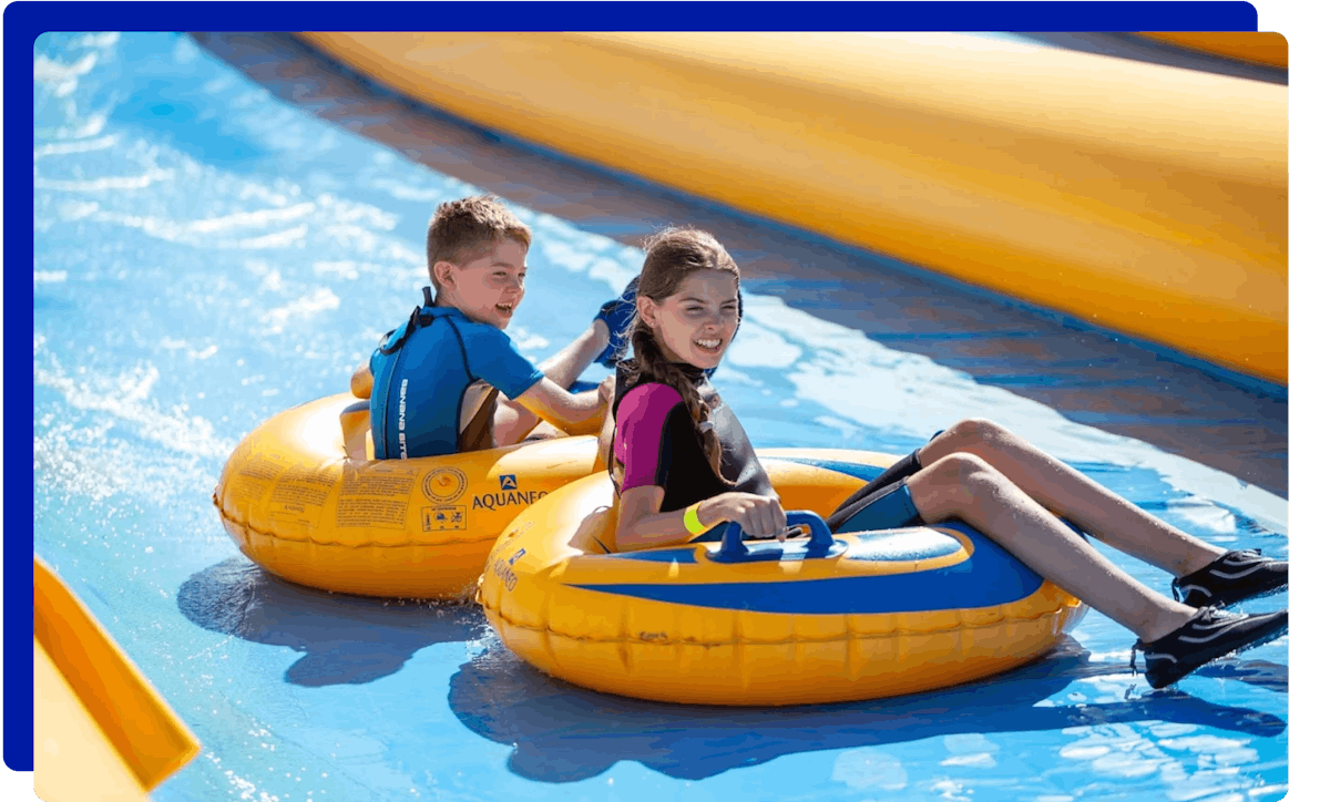 Children sliding down the slopes at Mega Slip and Slide Cornwall