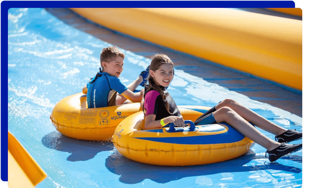 Children sliding down the slopes at Mega Slip and Slide Cornwall