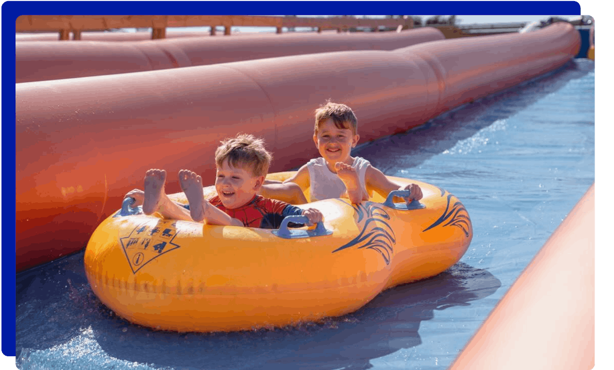 Children sliding down at Cornwall Slip and Slide in Newquay, Atlantic Reach Resort
