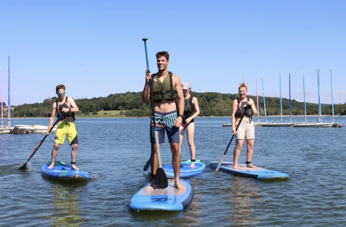 Group paddleboarding at Ardingly Reservoir in Haywards Heath
