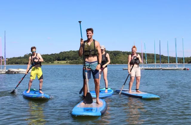 Group paddleboarding at Ardingly Reservoir in Haywards Heath