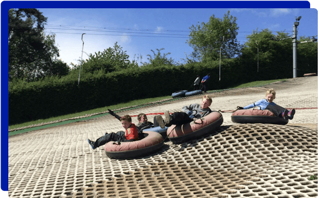 Children tubing at Cardiff Ski & Snowboard Centre in Cardiff