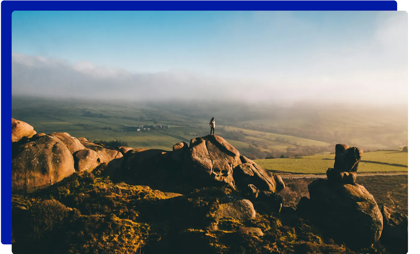 Walker on the rocks of The Roaches at sunrise, Staffordshire