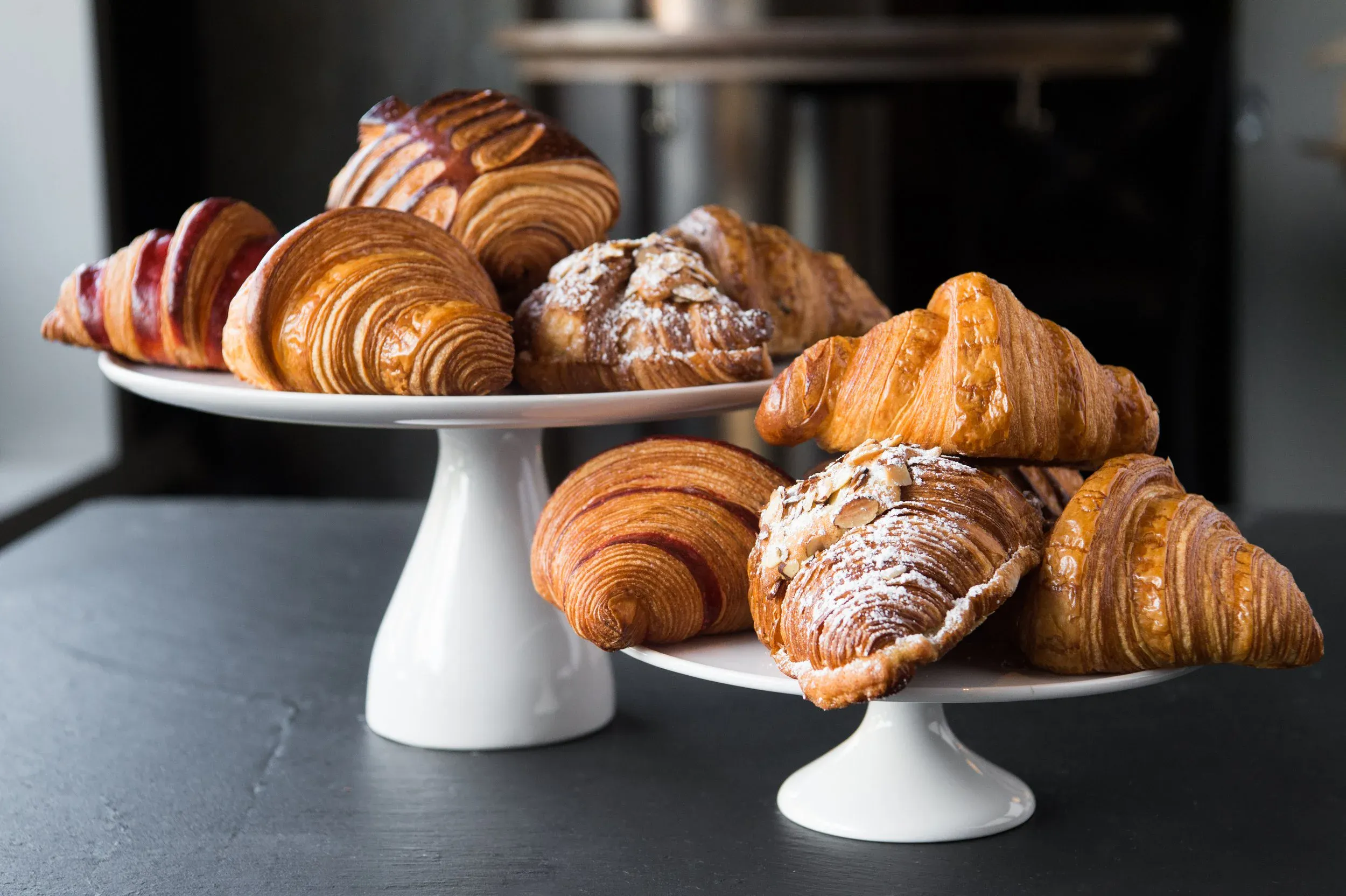 Croissants and viennoiserie on cake stands