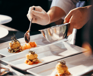 Private chef plating a coursed meal