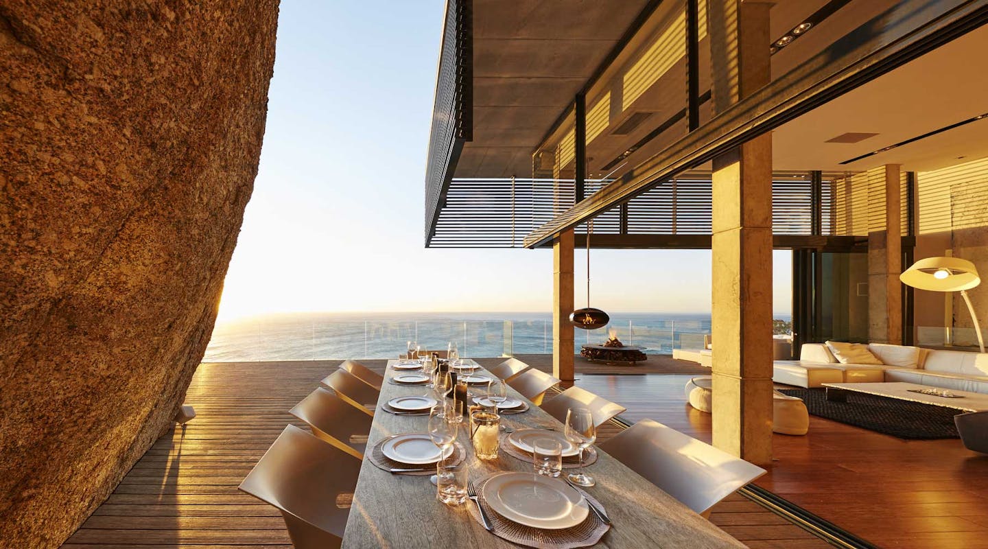 fine dining table setting in luxury home with ocean view