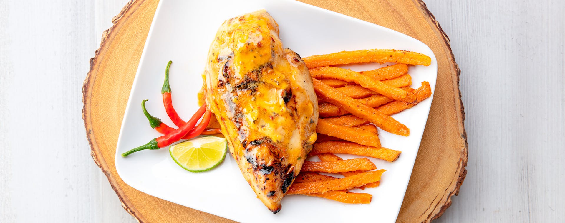Chicken with Chili Lime flavored butter and sweet potato fries