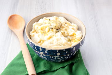 Mashed Potatoes with Roasted Garlic Herb flavored butter