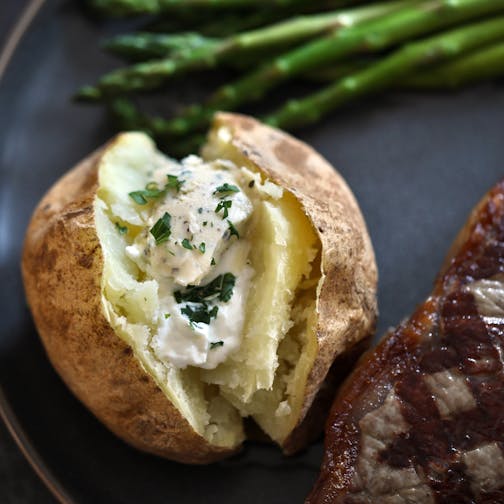 Baked Potato with Roasted Garlic Herb Flavored Butter