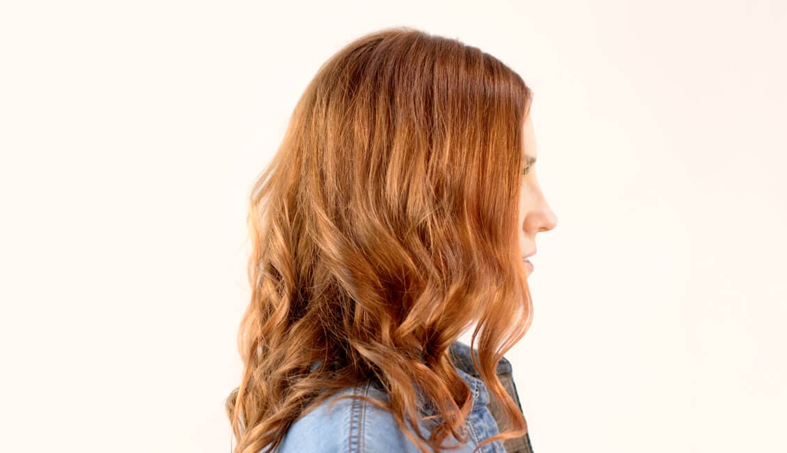 Image of esalon client Julia in a custom pumpkin spice hair color trending for fall