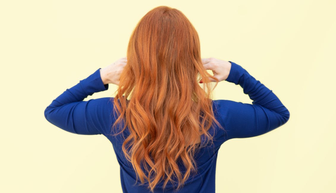 Image of esalon client back of head with custom trending summer hair color in copper apricot delight