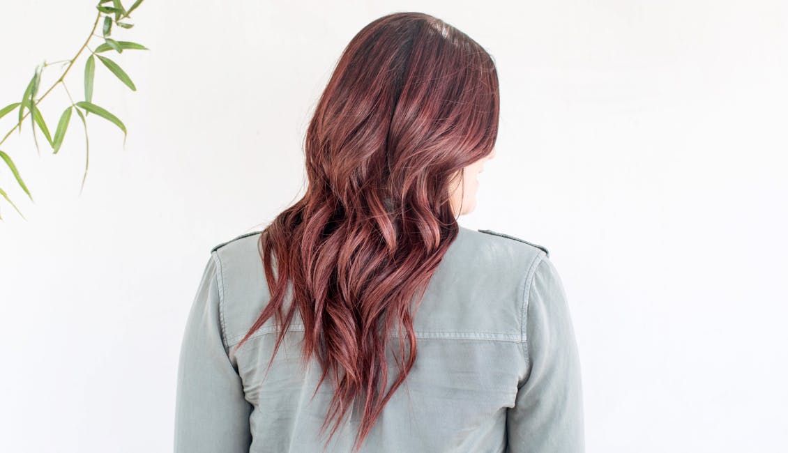 Image of eSalon client with trending custom warm chocolate cherry hair color for spring