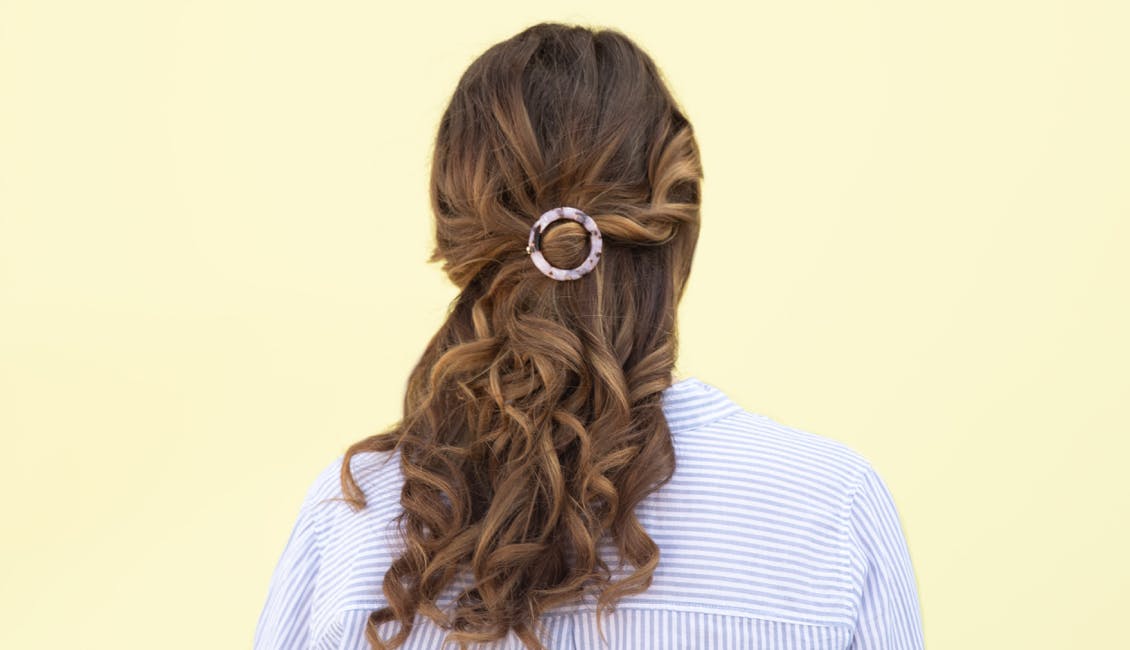 Image esalon client back of head shot showing custom trending summer hair color in lemon honey brunette