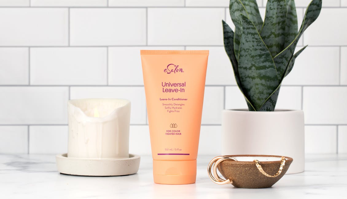 Product image of Universal Leave-In conditioner displayed on a bathroom counter.
