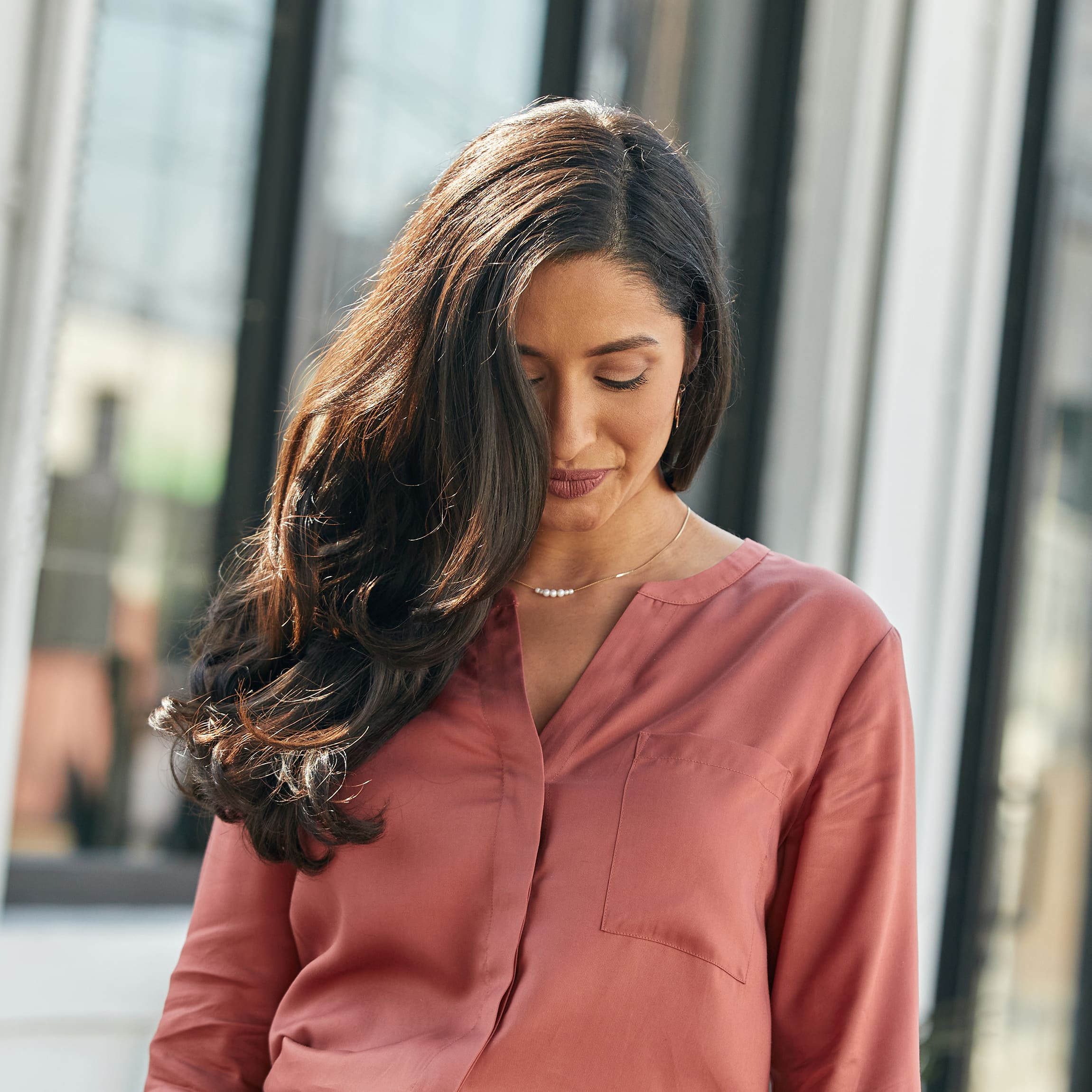 Woman with a Rich Chocolate Brunette hair color. 
