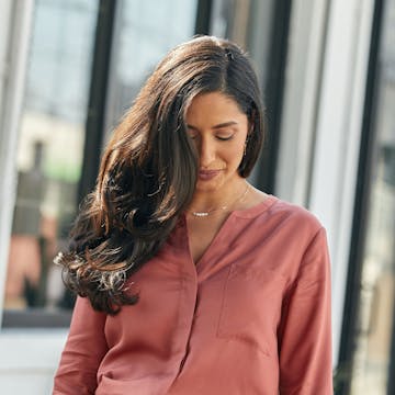 Woman with a Rich Chocolate Brunette hair color. 