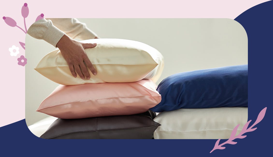 Person holding a silk pillowcase.