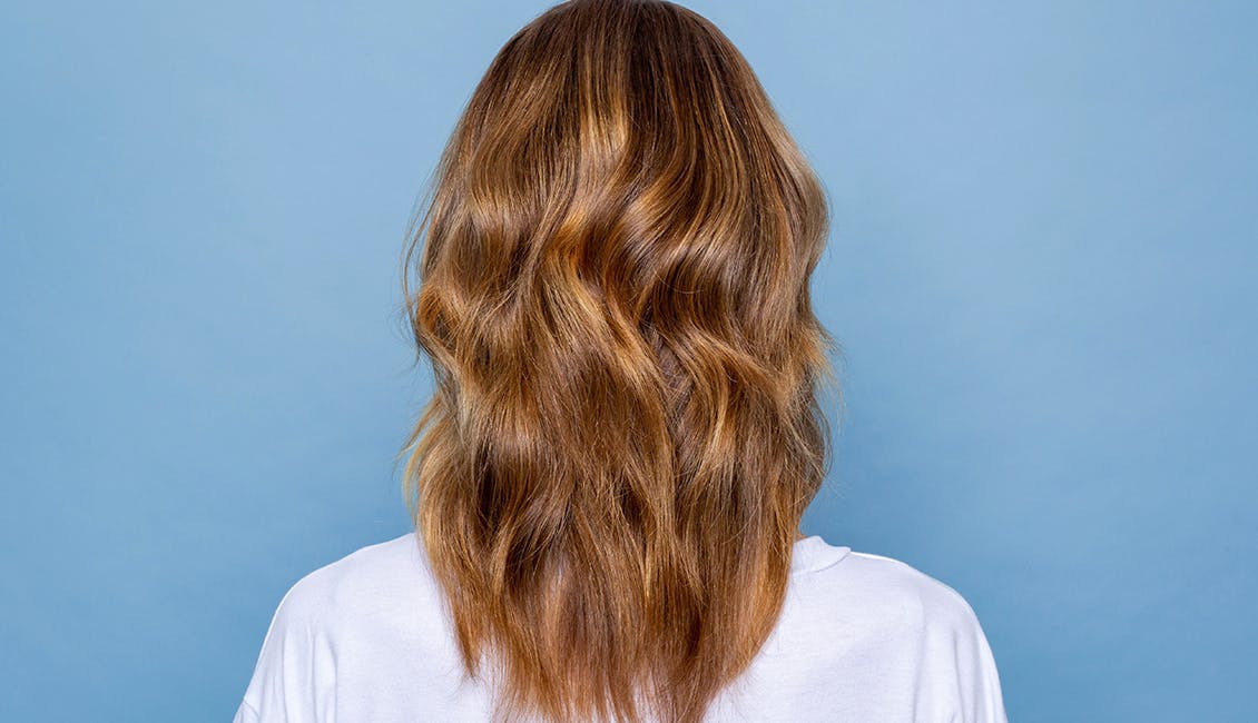 Woman with Deep Apricot Blonde hair. 