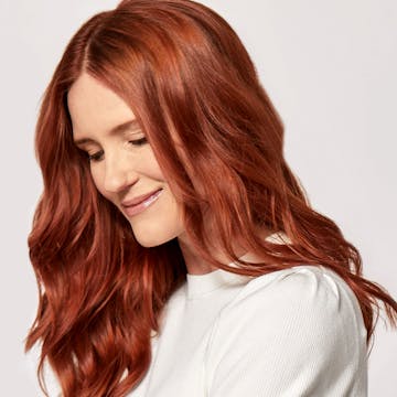 Woman with radiant red hair. 