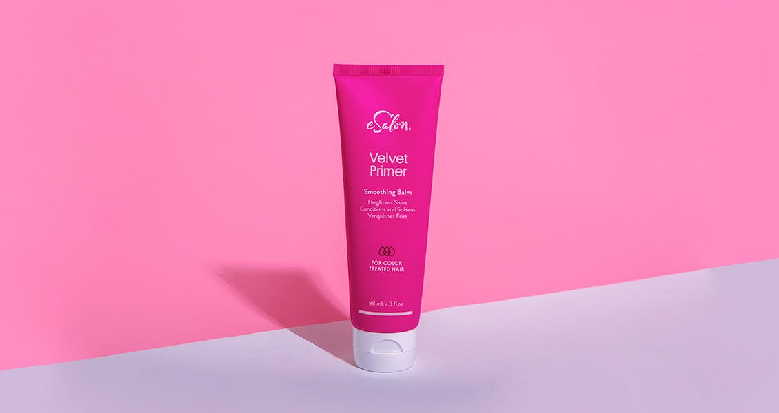 Product image of Velvet Primer displayed against a hot pink background.