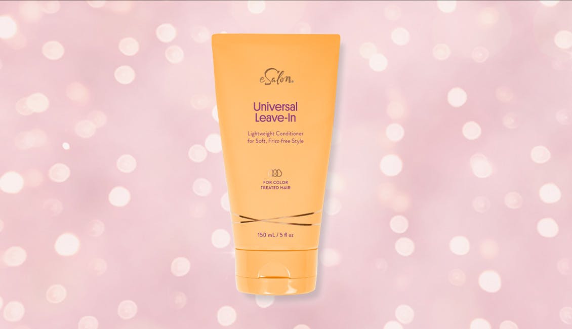 Universal Leave-In conditioner with sparkling lights behind it.