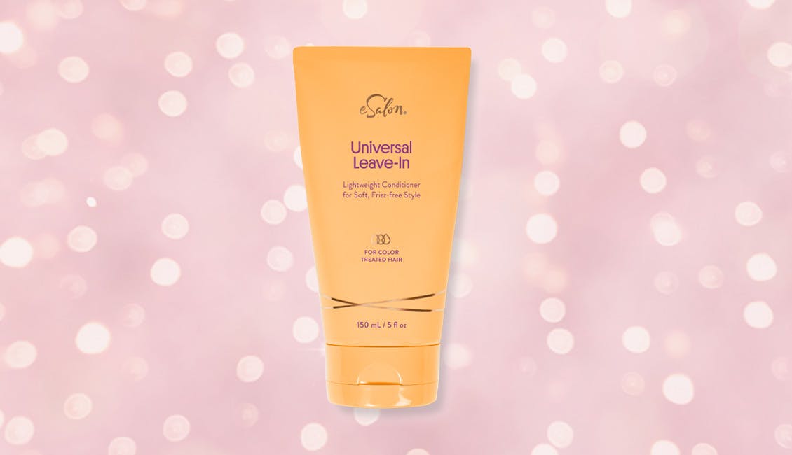 Universal Leave-In conditioner with sparkling lights behind it