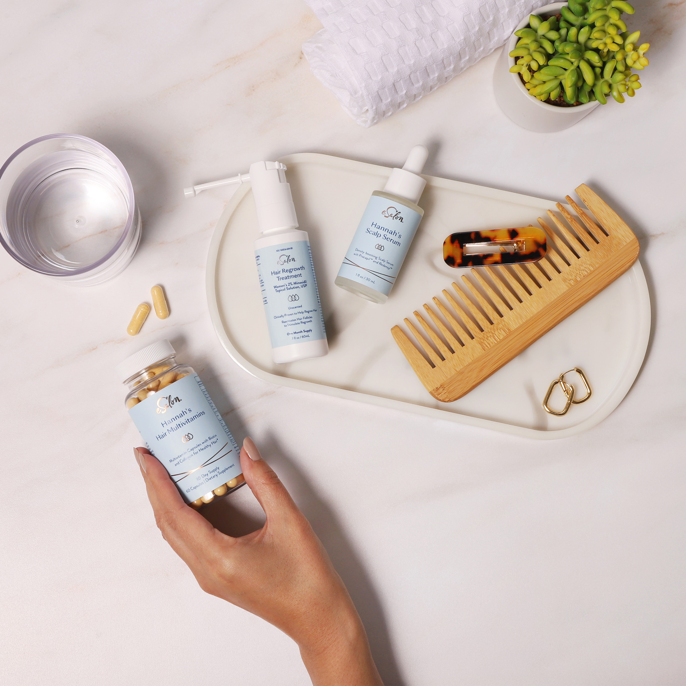 Bathroom counter with eSalon hair growth products. 