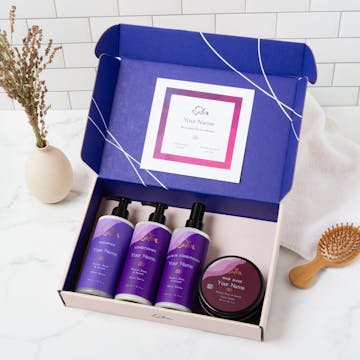 Open box showing the custom shampoo, custom conditioner, custom leave-in conditioner, and custom hair mask.