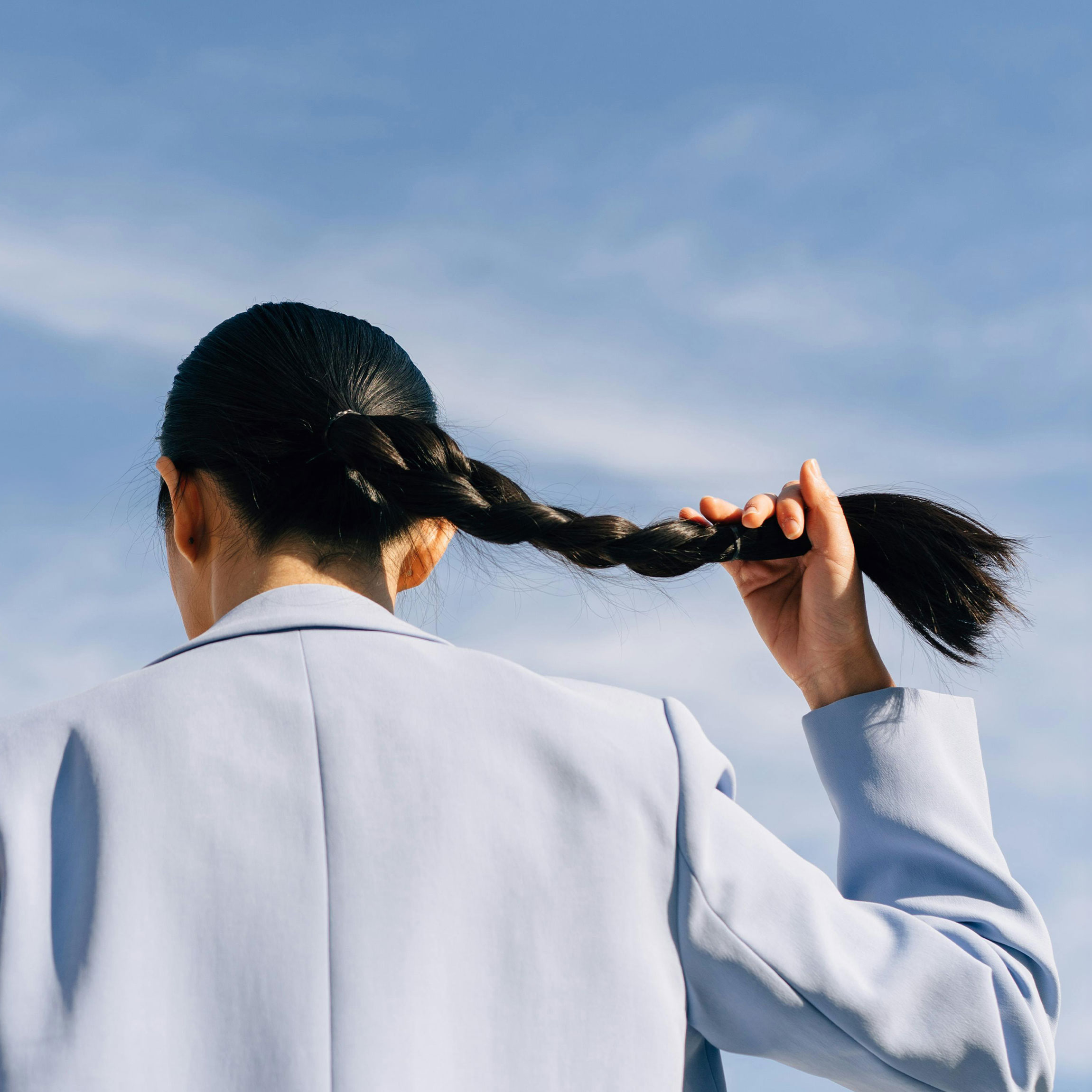 Woman with strong hair in a braid. 