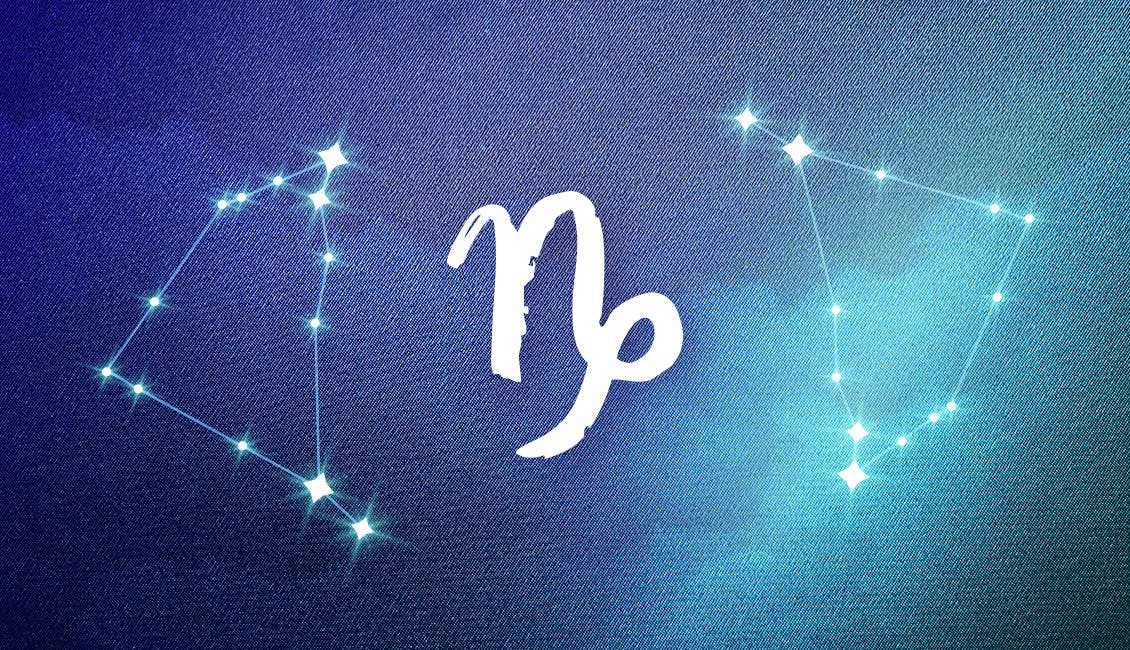The Zodiac symbol for Capricorn with a dreamy, celestial background.