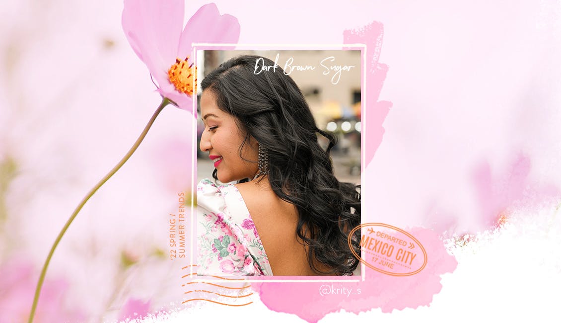 Our gorgeous Color Muse with long, wavy hair. She's showcasing our 2022 Spring and Summer hair color Dark Brown Sugar. This deep, rich brunette shade is a smoldering, shiny take on the classic dark brunette.