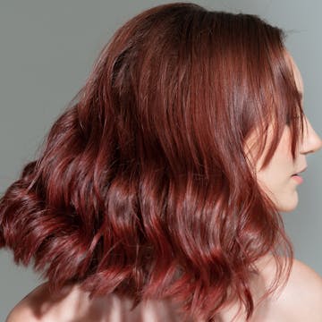 Woman with short red hair. 