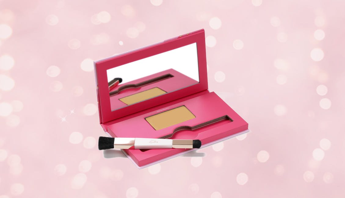 Conceal & Cover root concealing powder with sparkling lights behind it.