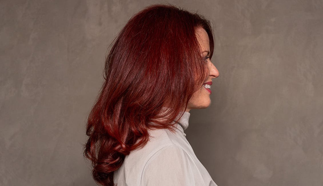 Woman with Runway Red hair. 