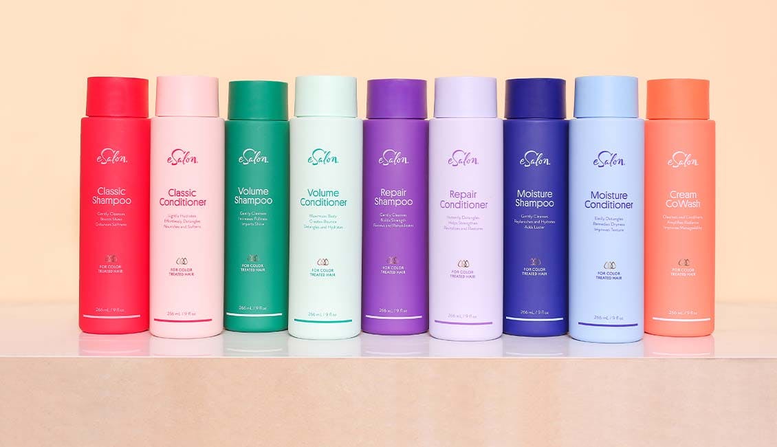 eSalon's colorful lineup of shampoo and conditioner duo bottles.
