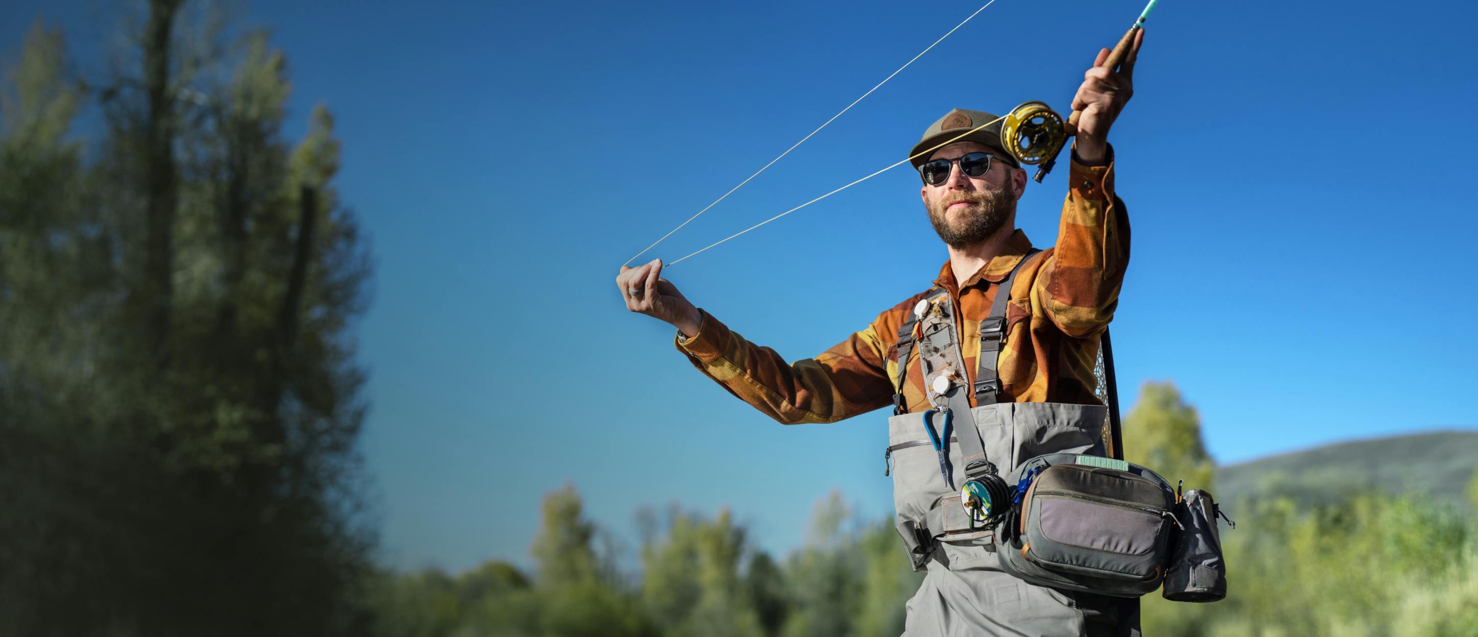 Man fishing wearing ROKA sunglasses