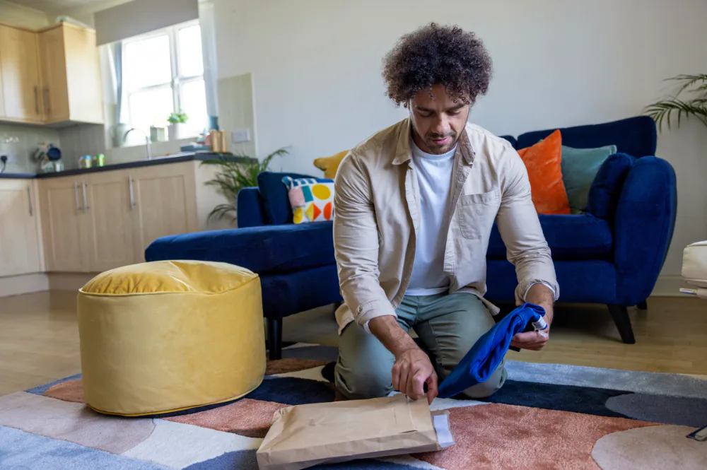 Customers sat on floor packaging items into mailing bag