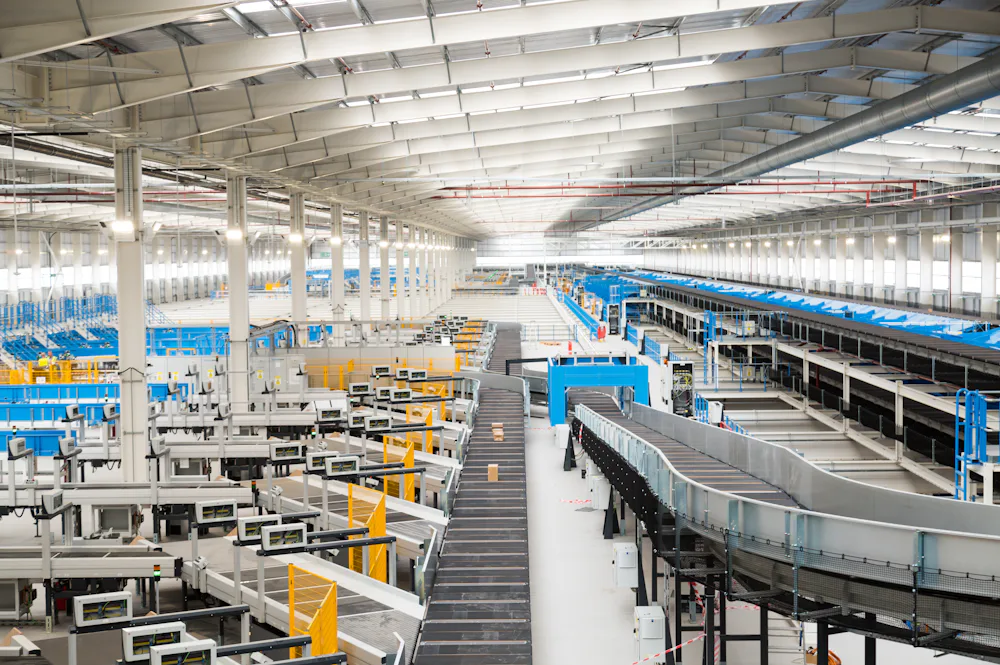 Evri's Barnsley hub interior, displaying vast rows of parcel sorters and conveyors