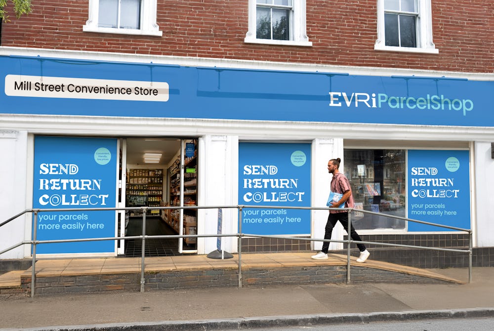 An Evri ParcelShop is in full view with its blue signage and a customer is walking up the accesssbility ramp and holding a parcel.
