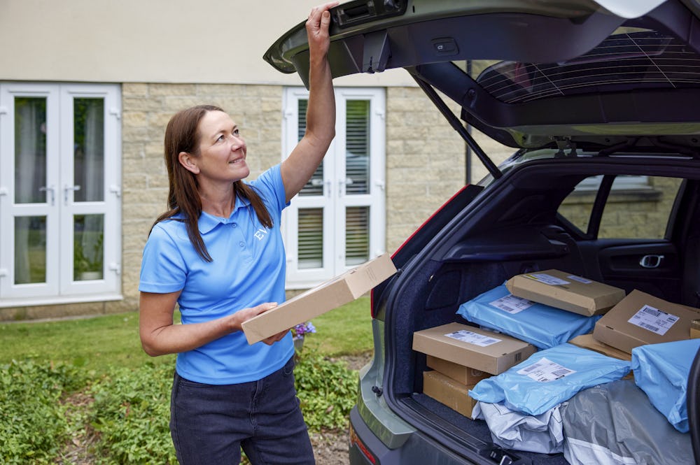 An Evri Courier closing their boot after retrieving the correct parcel for a delivery