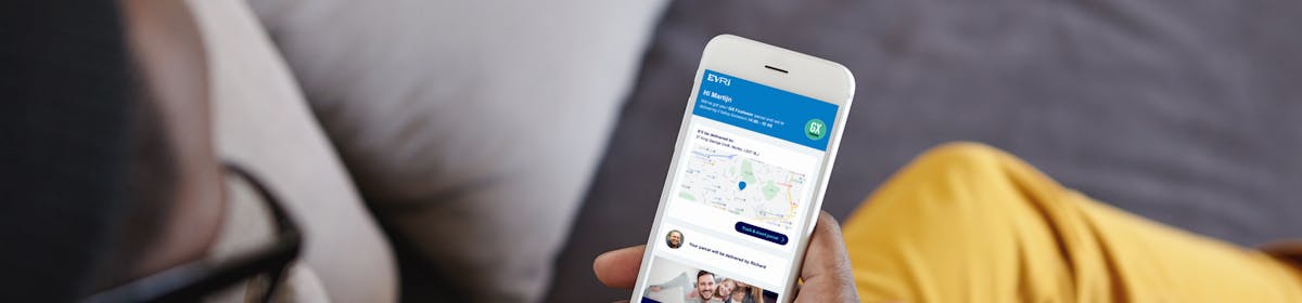 Customer looking down at their mobile with the display showing their international tracking in full view